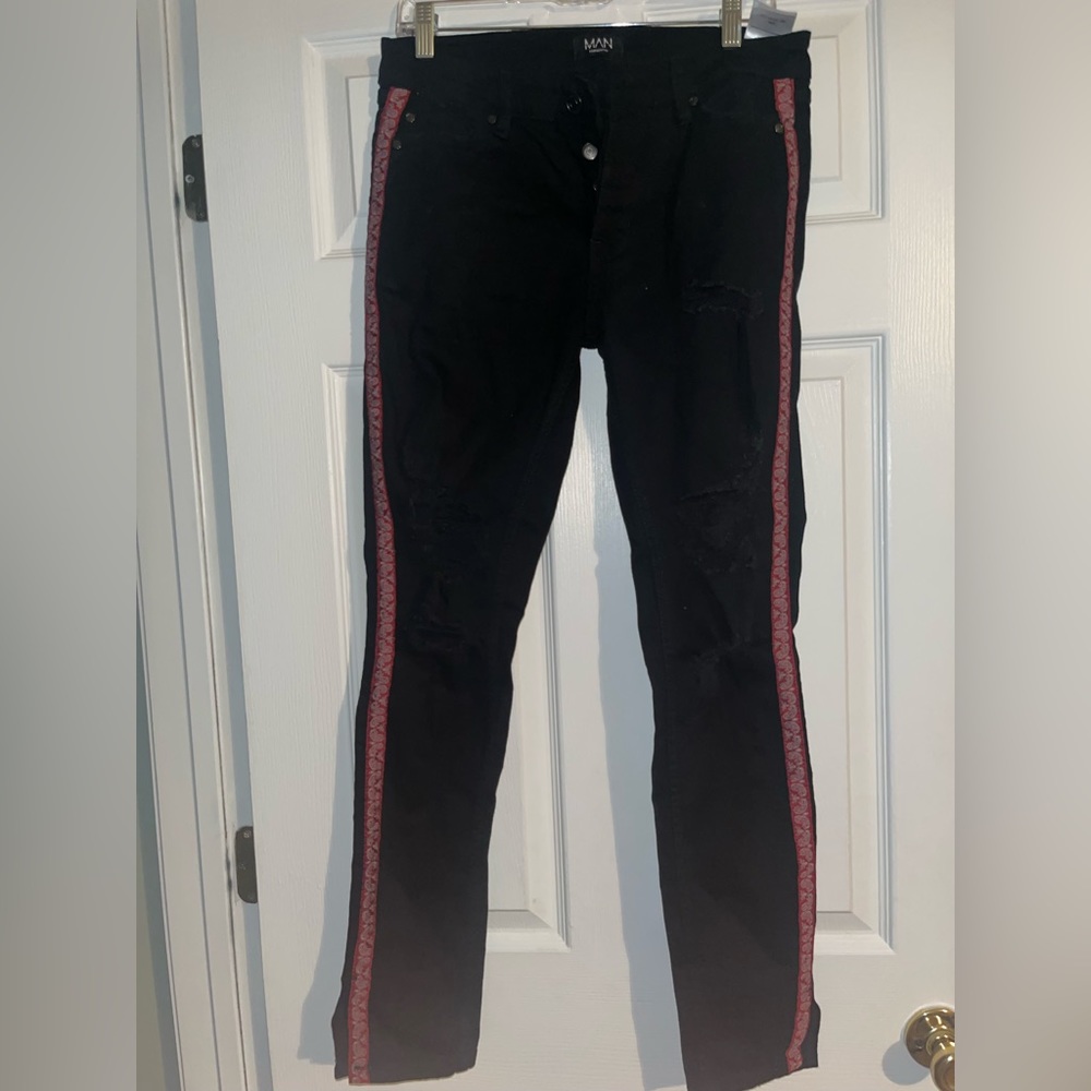 BoohooMAN jeans with red strip on the side and split at the bottom